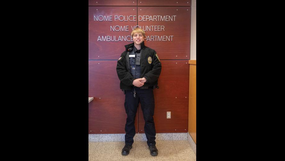 NEW TO THE FORCE – Son Erikson poses for a photo at the Nome Police Department on Tuesday, October 13. Photo by Ariana Crockett O’Harra
