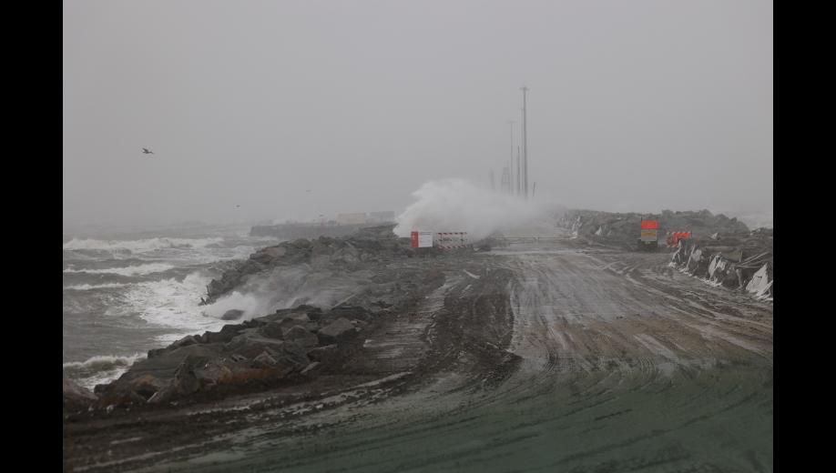 Waves crash over the causeway at the Port of Nome, on Oct. 23. Photo by Diana Haecker