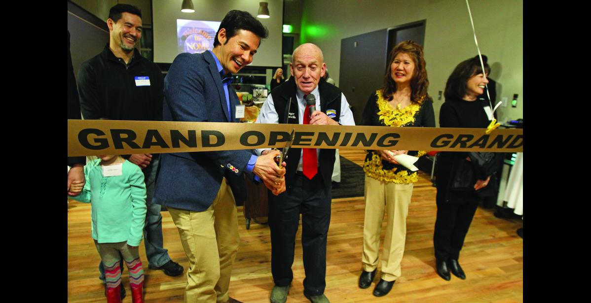 Photo by Diana Haecker RIBBON CUTTING— Rep. Neal Foster, left, and Nome Mayor Richard Beneville, right, cut the ribbon at the grand opening ceremony of the Richard Foster Building on Friday, Oct. 28. Looking on are Jimmy Foster, left, Hoa-Nih Foster, right, and Iris Magnell.