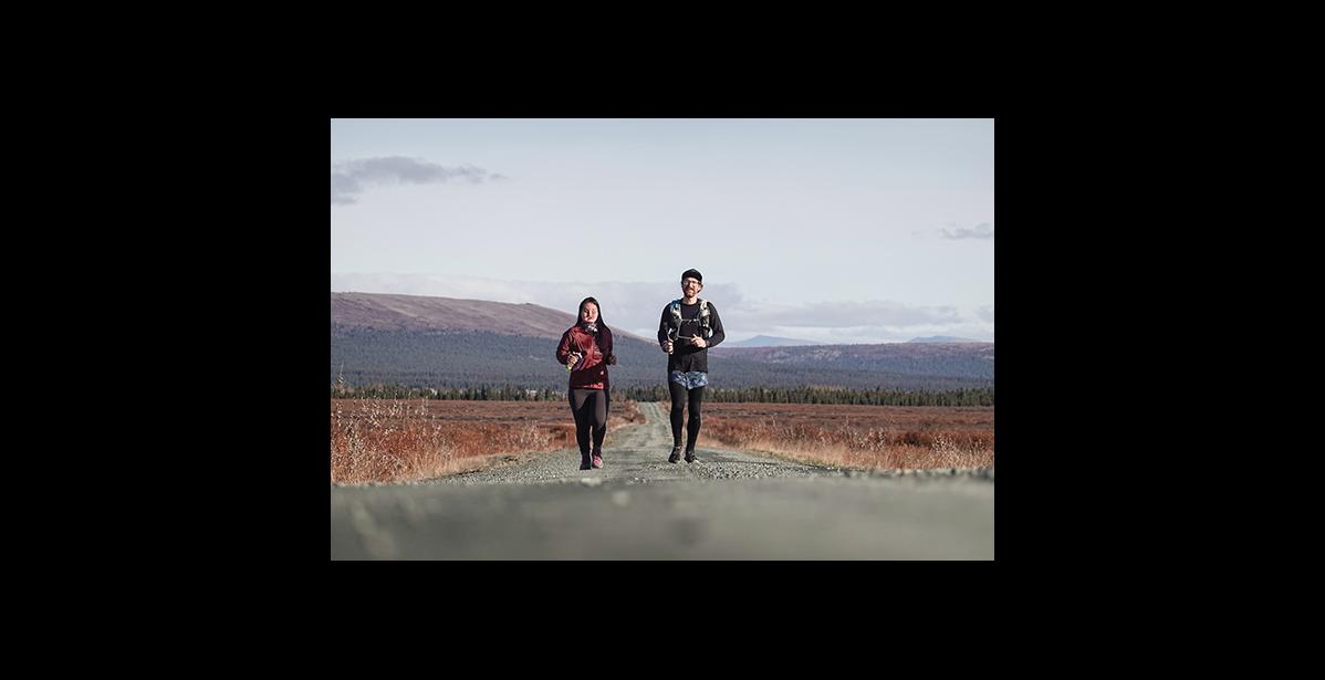 Photo courtesy Max Romey THE LONG ROAD—Carol Seppilu and Tim LeMaire run the long and lonesome road from Council on their way to Nome on Sept. 26.