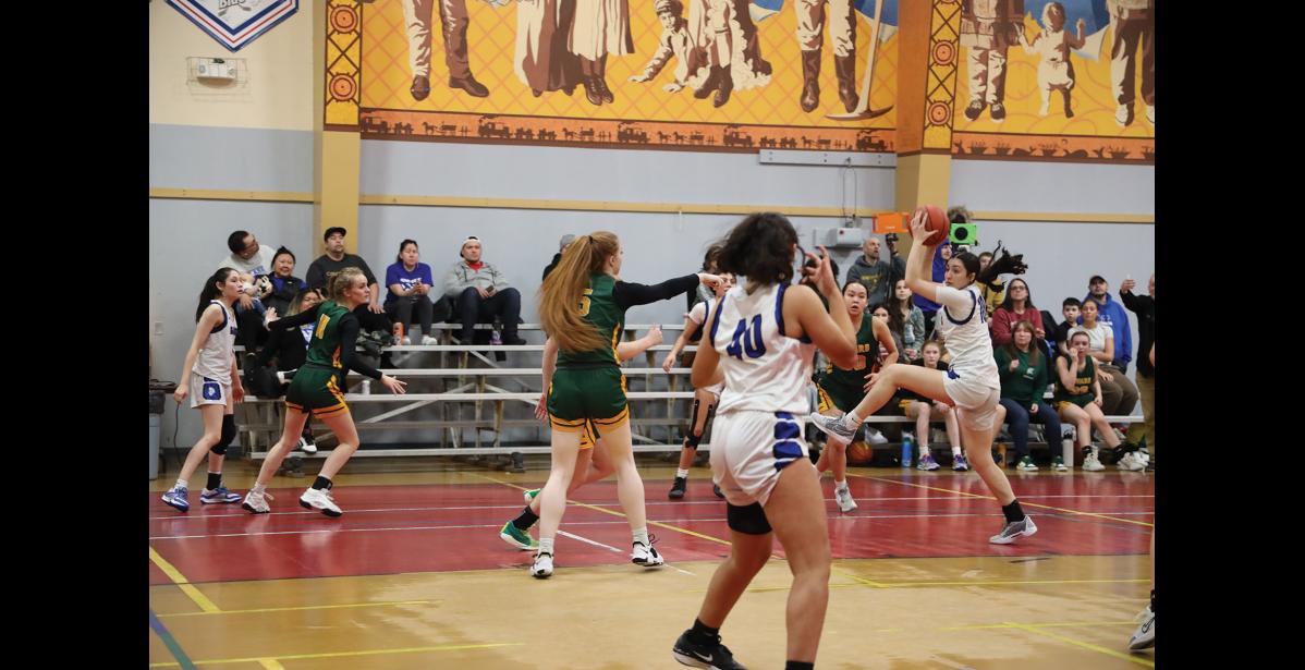 Photo by Anna Lionas WIND UP- Nanook BrookLynn Crowe catches the ball prepares to pass it.