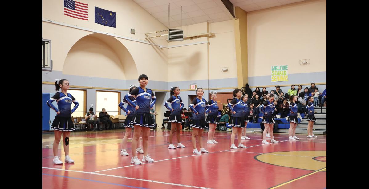 Photo by Anna Lionas FORMATION- the Nome-Beltz cheer team stands in formation as players are announced to start the Ruckus at the Rec Games.