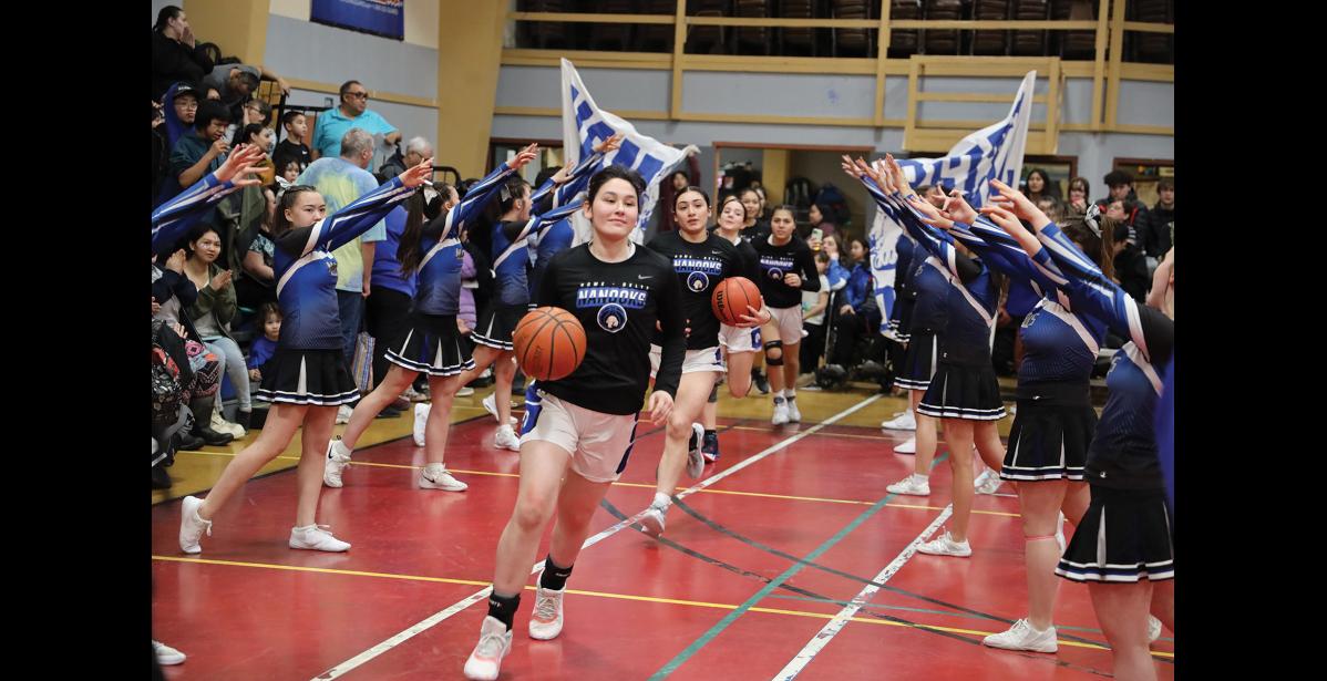 Photo by Anna Lionas BIG ENTRANCE- The Lady Nanooks take to the court Friday night of Ruckus at the Rec.