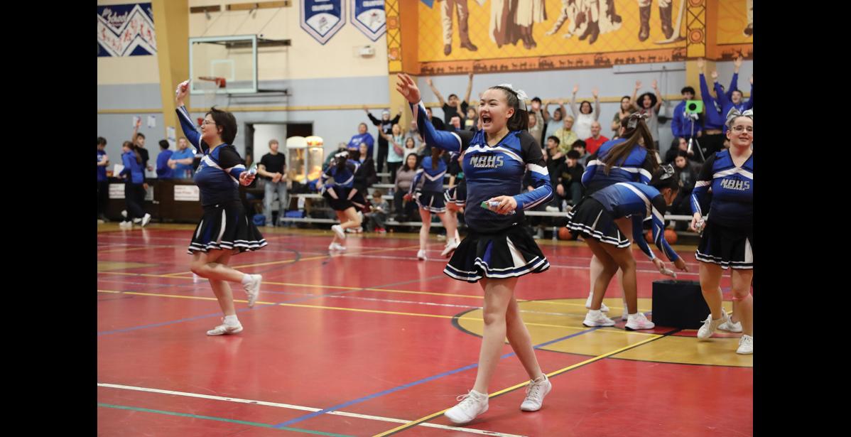 Photo by Anna Lionas CHEER FOR A PRIZE- Alohna Johnson and the Nome-Beltz Cheer team throws out goodie bags to the crowd at Ruckus at the Rec.