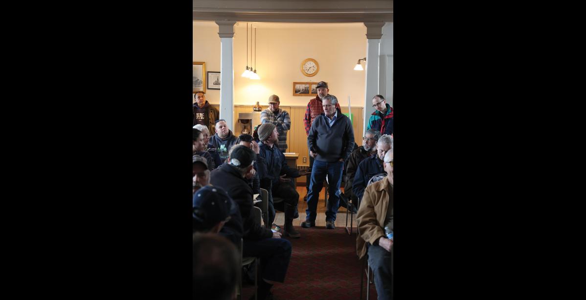 Photo by Anna Lionas MEETING— G1 Senior Vice President of Mining Mike Shaffner addresses a comment from the audience during the Monday, April 22 meeting at Old St. Joe’s in Nome.