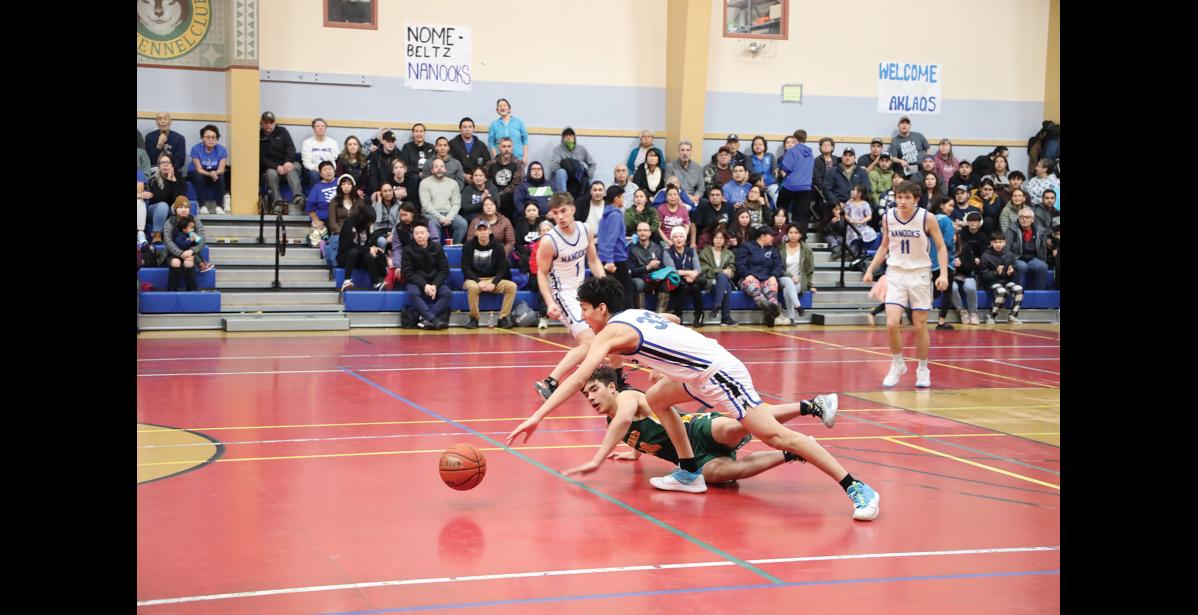 Photo by Anna Lionas ROLLING- Nanook Richard Cross and Seahawk Nick Ambrosiani tumble over each other while reaching for a rolling ball.