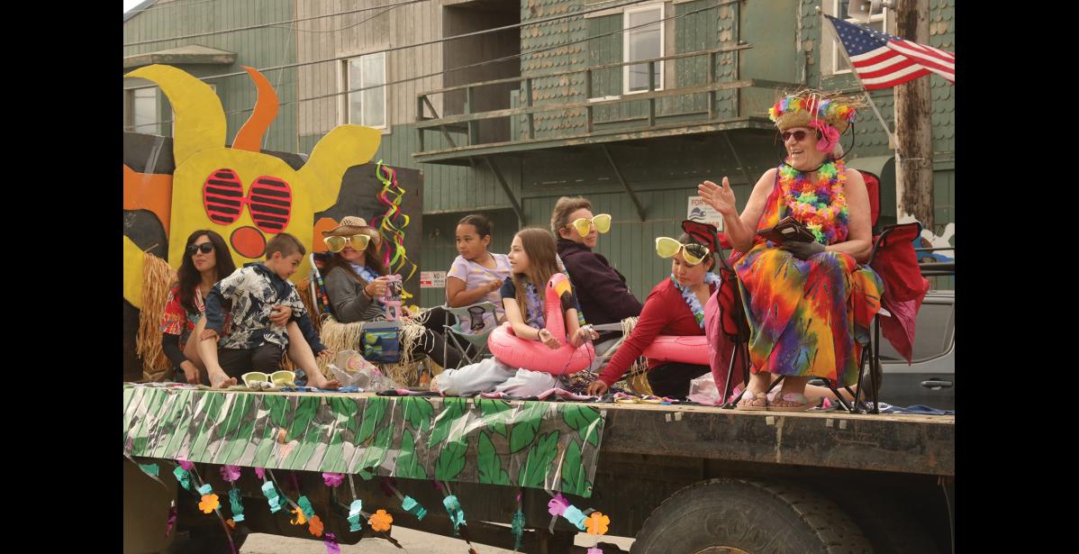 Photo by Laura Robertson HAWAIIAN—The colorful Q-Trucking float passes by in the Midnight Sun parade.