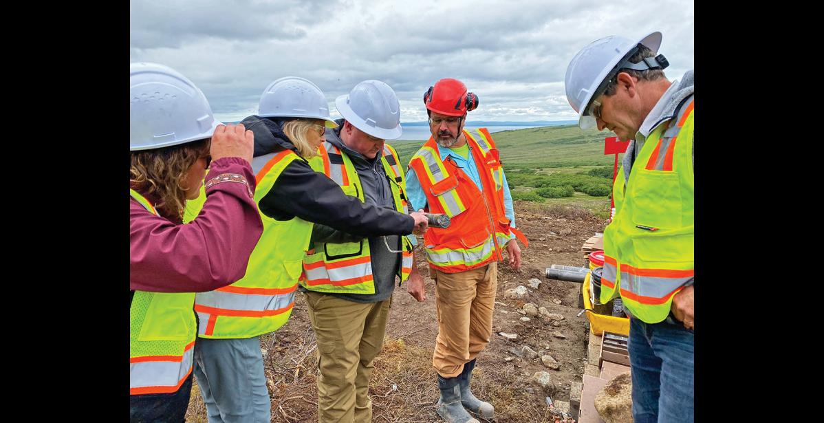 Photo courtesy Senator Lisa Murkowski's officew VISIT— Senator Lisa Murkowski, second from left, checks out a core sample at the Graphite One exploratory drill site, on Saturday, July 8.