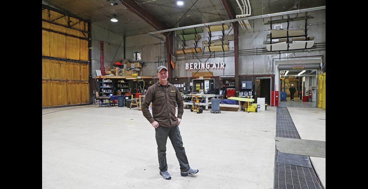 Photo by Megan Gannon BERING AIR — Russell Rowe of Bering Air stands inside the airline’s original hangar in Nome.
