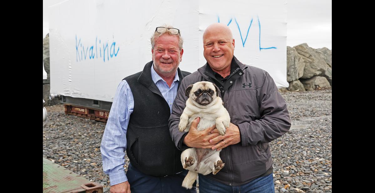 Photo by Megan Gannon PUGGING FOR THE CAMERA — White House advisor Mitch Landrieu holds Lupe, one of Mayor John Handeland’s pugs, during a tour of the Port of Nome last Thursday.