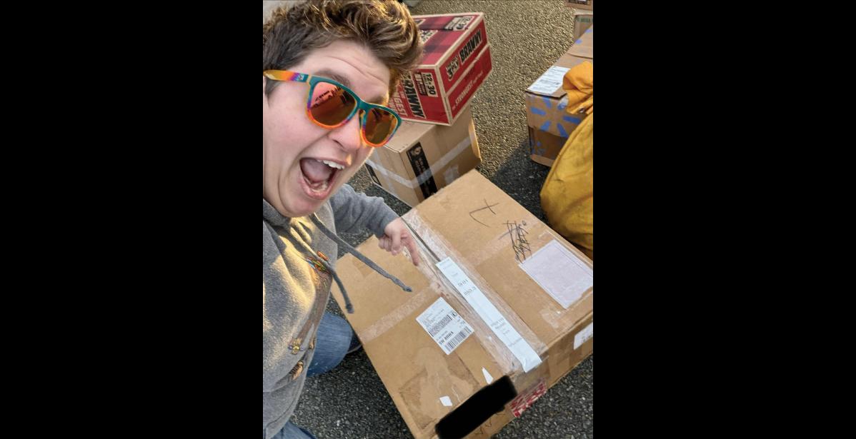 Photo courtesy Maggie Gray IT’S HERE!— Assistant Principal Maggie Gray points excitedly to part that was needed to fix the broken AWOS system in Shishmaref, to allow for FAA weather reporting again.