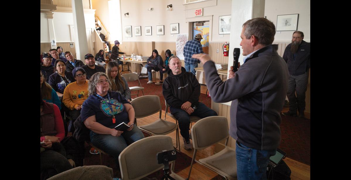Photo by Nils Hahn MEETING— G1 Senior Vice President of Mining Mike Shaffner addresses a comment from the audience during the Monday, April 22 meeting at Old St. Joe’s in Nome.