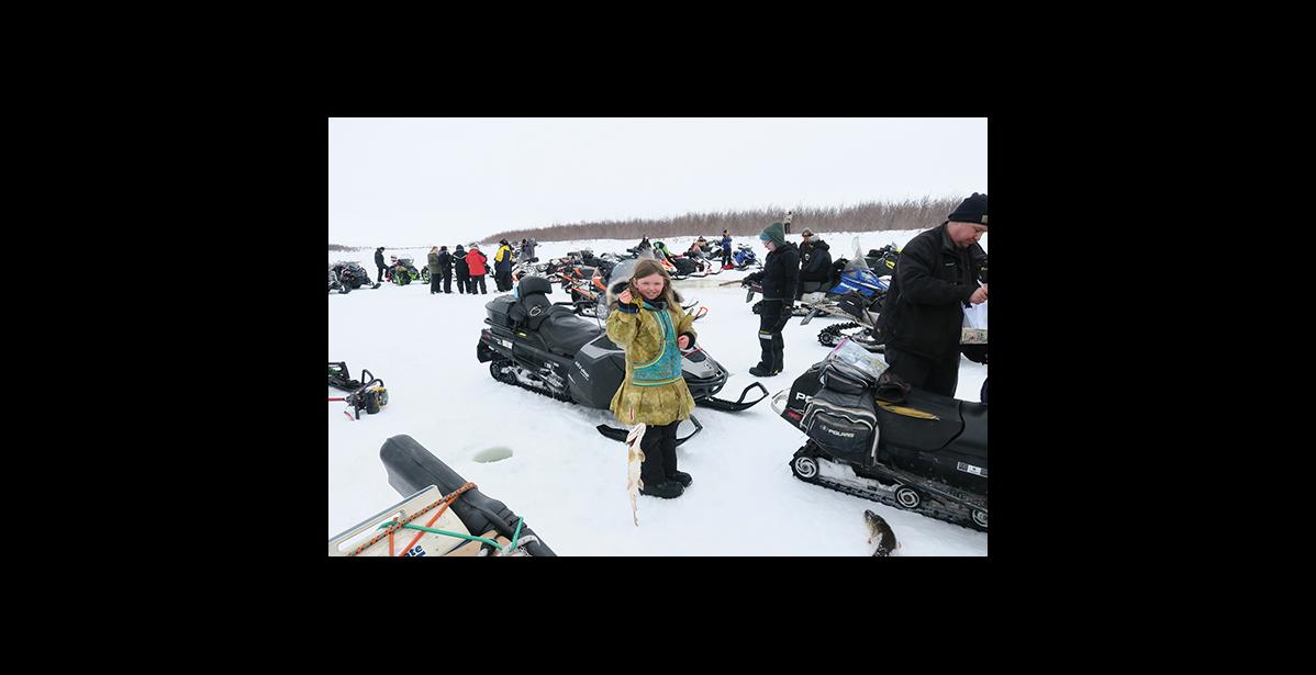 PIKE DERBY — Neva Horton shows off the pike she caught during last Saturday's fifth annual Pilgrim River Pike Fishing Derby.