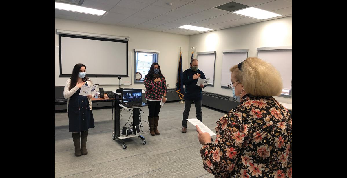 Photo courtesy NSHC ITS OFFICIAL— Nursing instructor Flo Kassly leads graduates Alyse Morris, Kallie King, Daniel Hobbs and their remotely participating classmates in an oath as part of their graduation ceremony.
