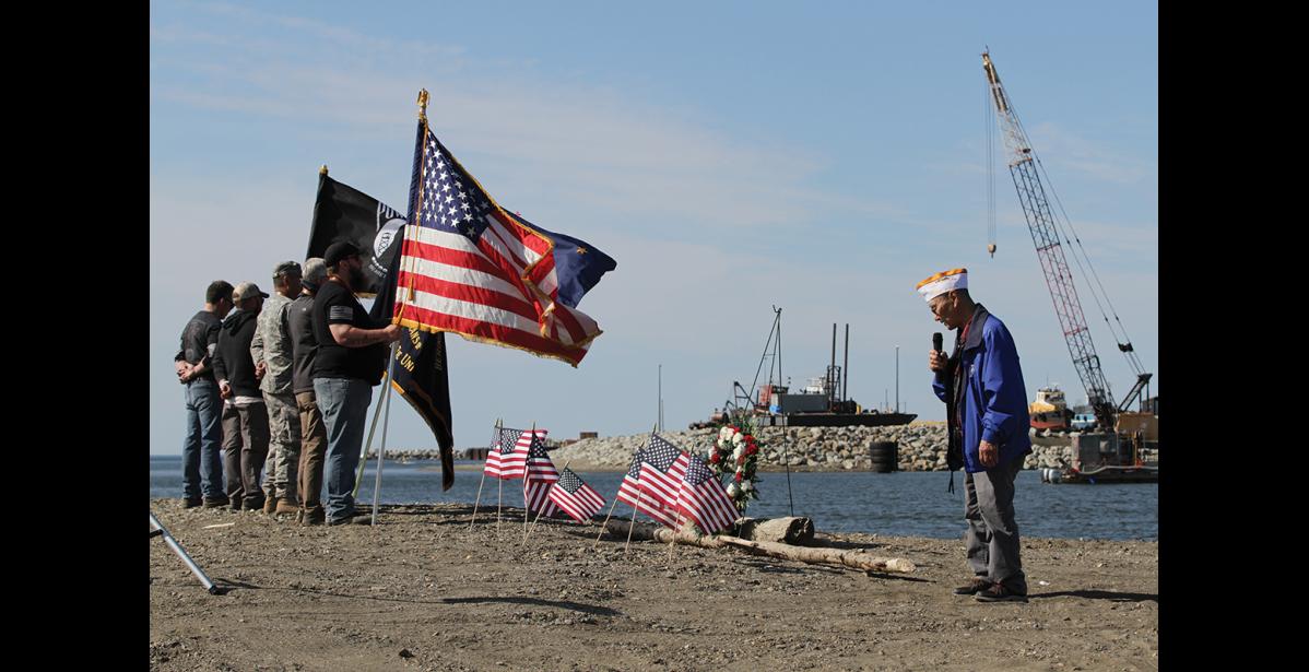 Photo by Peter Loewi PRAYER—Nome VFW Chaplain Aaron Iworrigan leads a prayer at Belmont Point for service members lost at sea.
