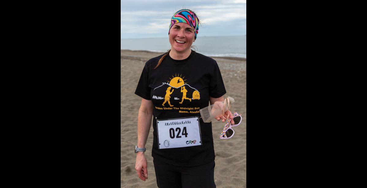 Photo by Sarah Manriquez As the first female finisher to cross the line, Elizabeth Korenek-Johnson earned a gold nugget prize during the Gold Dust Dash 5K on Saturday, June 21, 2025.