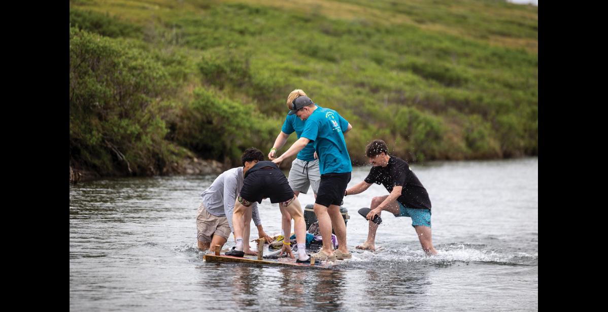 Photo by Sarah Manriquez Team Gold Digger pushes off first at the start of the annual Midnight Sun Raft Race on Sunday, June 22, 2025, beginning at Mile 13 along Kougarok Road.