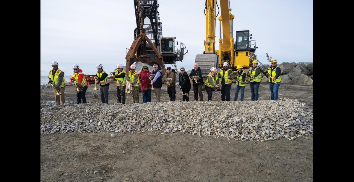 GROUNDBREAKING— Representatives from the U.S. Army Corps of Engineers, city officials and Kiewit representatives celebrate the Nome Port Modification Project’s groundbreaking on Sept. 2 at the end of the causeway at the Port of Nome. Photo by Ariana Crockett O'Harra