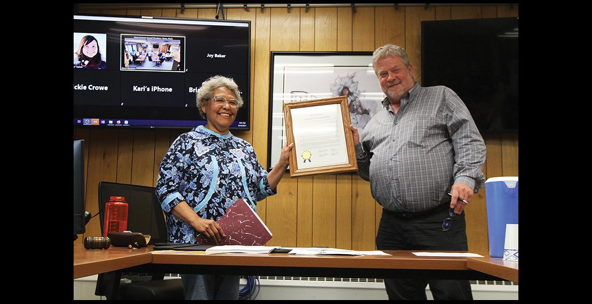 Photo by Diana Haecker HONORED— Josie Bourdon received a commendation from the Alaska State Legislature for a lifetime of dedication teaching the Inupiaq language. She was honored at last Monday’s Nome Common Council meeting with Mayor John Handeland reading the Legislature’s citation into the record and presenting the framed document to Ms. Bourdon.