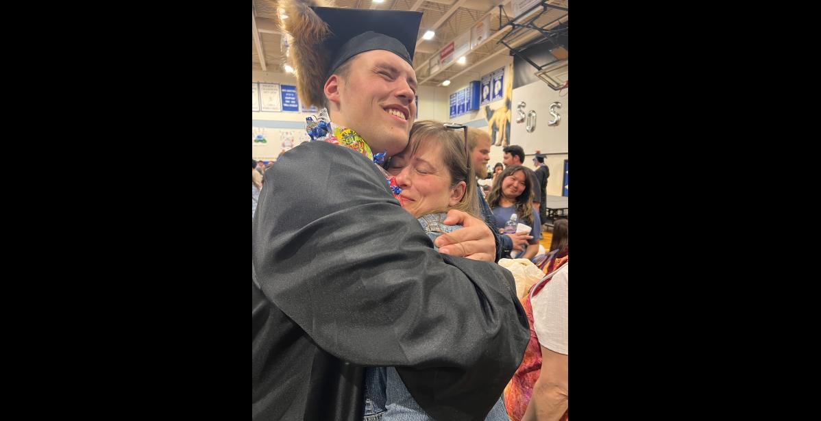 Photo by Diana Haecker CONGRATULATIONS— After last week’s Nome-Beltz Class of 2026 graduation ceremony, proud mother Carlee Hobbs gets a bear hug from her son Wesley.