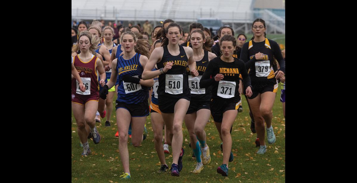 Photo by James Mason LEADING THE PACK— Unalakleet’s Ourea Busk leads the pack at the start of the cross country state championship race in Anchorage, with teammate Isabella Eller at her shoulder. Busk went on to win her second consecutive state title in the Division III