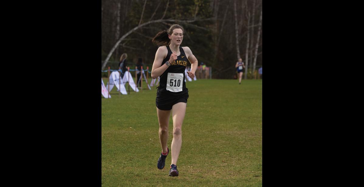 Photo by James Mason RUNNING ALONE – As she approached the finish Ourea Busk has a clear lead over the second-place runner.