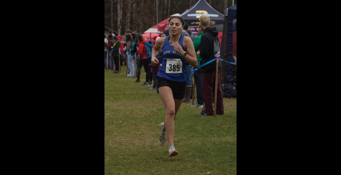Photo by James Mason FAST FINISH – In the Division II girls race Nome Nanook AwaLuk “Wookie” Nichols finished a strong 6th place.