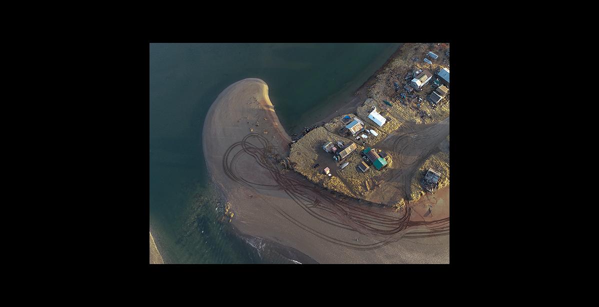 Photo by James Mason NEW LOOK – The eastern tip of the Fort Davis sand spit was eroded away and the Hukill cabin were washed upriver, and rests about half a mile upriver from the Nome River bridge.