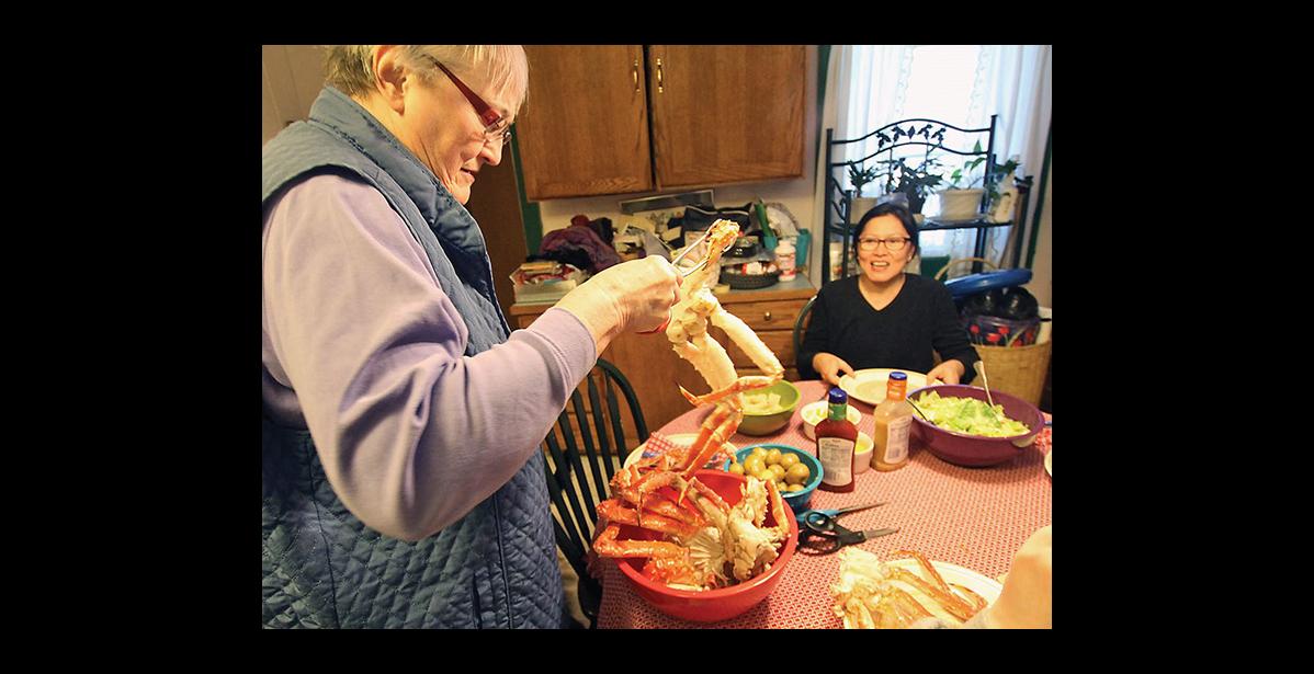 Photo by Al Grillo During Iditarod time, Nancy McGuire opened her home and kitchen to countless visitors who would get the royal treatment of a king crab meal.