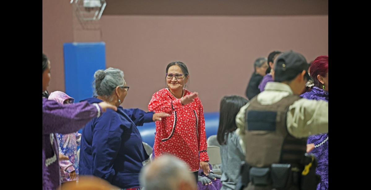 Photo by Megan Gannon JOINING IN — President of the Native Village of Wales Anna Oxereok participates in the dancing.