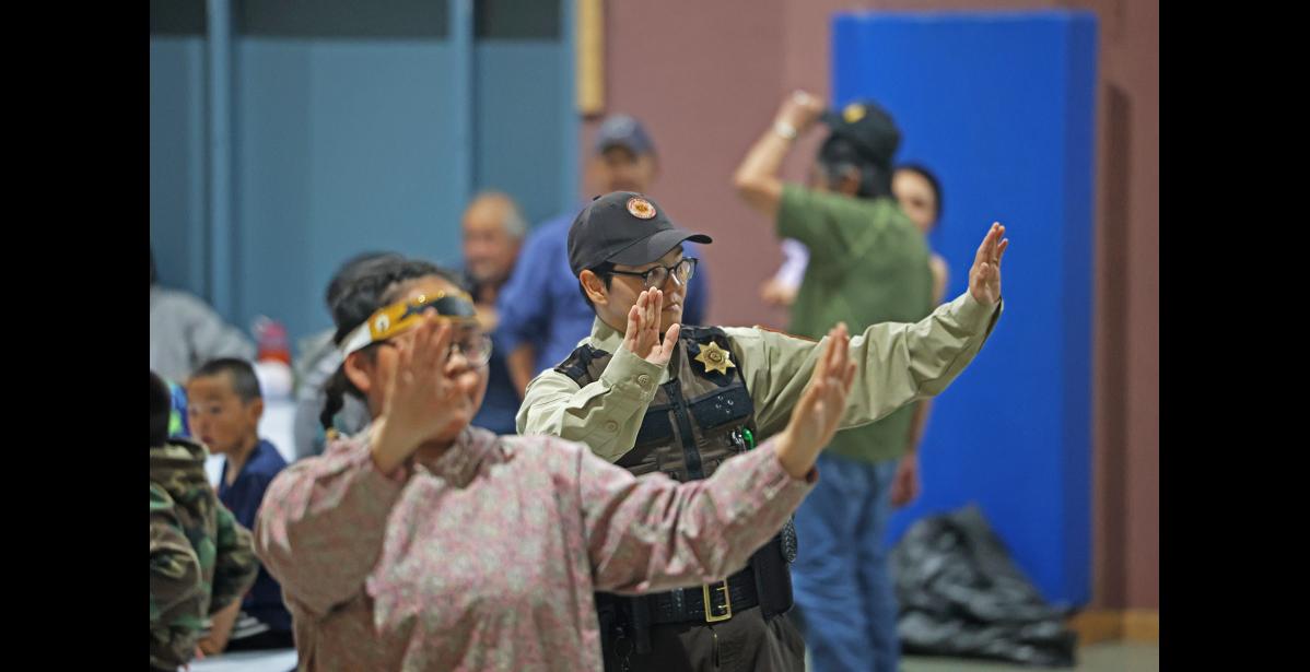 Photo by Megan Gannon ON DUTY — Ida Kava joined the Gambell group for a few dances. Kava, who began her role as a VPSO in Savoonga in May, was on duty during KDF as Wales currently has no VPOs or VPSOs.