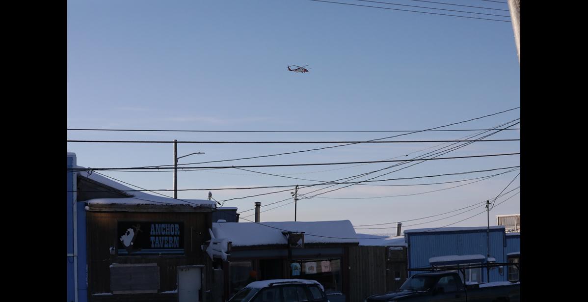 Photo by Diana Haecker A Coast Guard helicopter returns to Nome around 1 pm on Friday afternoon.