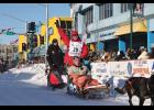 Photo by Anna Lionas NOME GROWN— Iditarod musher Aaron Burmeister of Nome begins the ceremonial ride through Anchorage on March 2 with his Idita-Rider Tony Capone in the sled and son Hunter Burmeister riding the second sled. This is Burmeister’s 22nd run of the Iditarod Trail Sled Dog race.