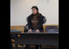 Photo by Anna Lionas SPEAKING UP— Trinh Johnson addresses the Public Safety Advisory Commission with her concerns on the Nome Police Department on Monday April 2.