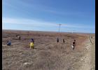 CLEANING UP— Nome Elementary School fourth grade students spent Friday cleaning up windblown trash on the tundra from the City of Nome’s landfill facility at the Beam Road