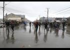 Photo by Lizzy Hahn DOWNPOUR— The egg race came with a twist as torrential rains poured down on racers during the Fourth of July streetgames held on Sunday.