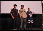 Photo by Megan Gannon FAMILY — Chris Apassingok (center) stands with his brother Chase (left) as well as his partner Ina and their baby Gracelyn during the screening of “One With The Whale.”