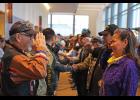 Photo by Megan Gannon VETERANS — Army Sergeant William Smith and Air National Guard Staff Sergeant Wanda Solomon-Parsons salute each other after the veterans’ walk at AFN on Thursday morning.