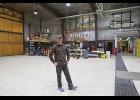 Photo by Megan Gannon BERING AIR — Russell Rowe of Bering Air stands inside the airline’s original hangar in Nome.