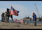PRAYER—Nome VFW Chaplain Aaron Iworrigan leads a prayer at Belmont Point for service members lost at sea.