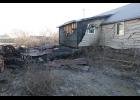 Photo by Diana Haecker BURNED— A suspicious fire consumed Randy Oles’ shed and partially burned the wall of his house on Steadman, on Tuesday night. The police are investigating a series of suspicious fires that occurred in the area over a span of a few weeks.