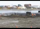 BARGE RAMP REPAIR— Repairs of the launch ramp replacement hit a snag due to stormy weather, making it difficult to de-water the area to replace the concrete barge ramp. With the help of the pictured ‘aqua dam’ project contractors hope to achieve the de-watering to allow the installation of the concrete ramp
