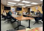 Photo by Diana Haecker The Nome Common Council listens to testimony by people in the audience during a work session on Monday, Dec. 11 as the ponder the question to keep operating a Nome Ambulance department or to hand over the service to NSHC.