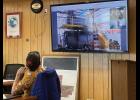Port Commissioner Gay Sheffield looks at an incinerator model, as the port positions itself to receive solid waste from ships calling on the Port of Nome. 