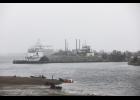 Photo by Diana Haecker The port is busy with gravel operations on the causeway and several visits from cruise ships. Pictured is a barge loaded with rock, with the cruiseship Roald Amundsen docked in the background, on Friday, August 18.