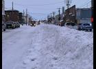 Photo by Diana Haecker WALLS OF SNOW— DOT and city crews were busy clearing the town’s roads after a week of snow, wind and more snow.