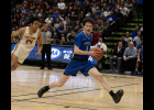Photo by James Mason NERVES OF STEEL—Nome Nanook Orson Hoogendorn moves the ball into the danger zone with less than 10 seconds to play in last Saturday’s State Championship game against Mt. Edgecumbe. With just two seconds left he delivered a buzzer-beating 3-pointer to put the Nanooks into the lead and cinch the state title for 2024