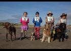 Photo by James Mason NOME DOG FAIR— The Nome Kennel Club held its first Dog Fair on Saturday, Aug. 24 outside the Mini Convention Center in Nome. Kids and their dogs had a grand time, as evidenced by the smiles of winners in the Kid’s Dash: (left to right) Nevelo Hoogendorn and Ruby, Kathrynne Dixon and Gidget, Amelia Richards and Winter, and Rosalie Richards with Tikaani.