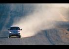 RAISING DUST – A pickup truck on Greg Kruschek Avenue raises a cloud of dust. With no snow yet Nome is a dusty place. 