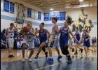 Photo by James Mason TAKE THE SHOT – JV Nanook Jon Smith lines up a shot in action against the Lady Nanooks during Saturday’s basketball games.